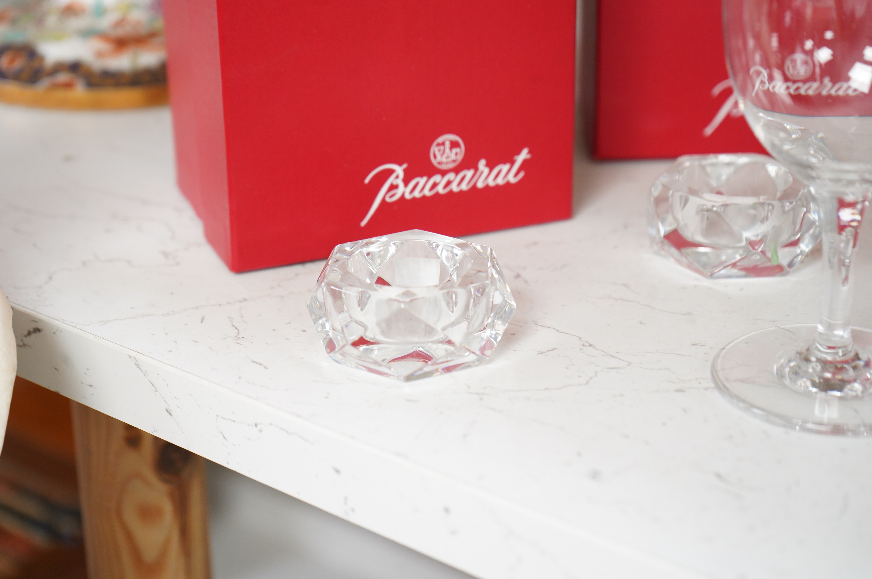 A set of twelve Baccarat crystal wine glasses and two tea light holders, with boxes, glasses 13cm high